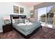 Bright bedroom with king-size bed and balcony access at 17401 Serenidad Blvd, Clermont, FL 34714