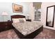 Spacious bedroom with carpeted floor and large window at 17401 Serenidad Blvd, Clermont, FL 34714