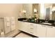 Double vanity bathroom with granite countertop at 17401 Serenidad Blvd, Clermont, FL 34714