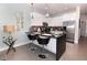 Modern kitchen with breakfast bar and stainless steel appliances at 17401 Serenidad Blvd, Clermont, FL 34714