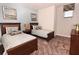 Guest bedroom with two twin beds and light blue walls at 17401 Serenidad Blvd, Clermont, FL 34714