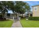 Sidewalk with access ramp leading to a screened patio at 2663 River Landing Dr, Sanford, FL 32771