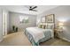 Large main bedroom with ceiling fan and en-suite bathroom at 2663 River Landing Dr, Sanford, FL 32771