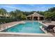 Community pool with lounge chairs and a covered pavilion at 2663 River Landing Dr, Sanford, FL 32771