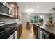 Bright kitchen with view to backyard and dining area at 2663 River Landing Dr, Sanford, FL 32771