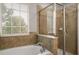 Updated bathroom with walk-in shower and window at 2663 River Landing Dr, Sanford, FL 32771