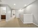 Upstairs hallway with carpet and access to bathroom at 2663 River Landing Dr, Sanford, FL 32771