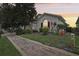 Home exterior with brick walkway and landscaping at 475 Windsor Pl, Davenport, FL 33896