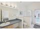 Bathroom with walk-in shower, vanity, and toilet at 475 Windsor Pl, Davenport, FL 33896