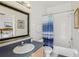 Bathroom with shower/tub combo, vanity, and mirror at 475 Windsor Pl, Davenport, FL 33896