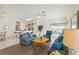 Spacious living room with a view of the kitchen and dining areas at 475 Windsor Pl, Davenport, FL 33896