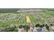 Aerial view of a residential community featuring numerous homes and lush green spaces at 475 Windsor Pl, Davenport, FL 33896