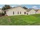 Spacious backyard with grassy lawn and patio at 475 Windsor Pl, Davenport, FL 33896