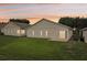 Rear view of house with large yard at 475 Windsor Pl, Davenport, FL 33896