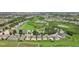 Aerial view of houses with pools and screened enclosures in a residential area at 475 Windsor Pl, Davenport, FL 33896