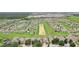 Aerial view of a residential community featuring numerous homes and lush green spaces at 475 Windsor Pl, Davenport, FL 33896