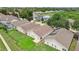 Aerial view of houses with pools and screened enclosures in a residential area at 475 Windsor Pl, Davenport, FL 33896