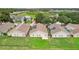 Aerial view of houses with pools and screened enclosures in a residential area at 475 Windsor Pl, Davenport, FL 33896