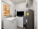 Functional laundry room with washer, dryer, and extra storage space at 166 La Paz Dr, Kissimmee, FL 34743