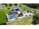 Aerial view of house, fenced backyard, and inground pool at 318 Stone Castle Loop, Lady Lake, FL 32159
