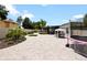Landscaped backyard with paved patio, trampoline, and gazebo at 318 Stone Castle Loop, Lady Lake, FL 32159