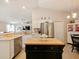 Modern kitchen with an island and breakfast bar, stainless steel appliances at 318 Stone Castle Loop, Lady Lake, FL 32159