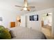 Spacious main bedroom with ensuite bathroom and large TV at 318 Stone Castle Loop, Lady Lake, FL 32159