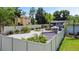 Spacious backyard oasis with a trampoline and a covered patio area at 318 Stone Castle Loop, Lady Lake, FL 32159