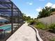 Spacious patio with a view of the pool and fenced backyard at 318 Stone Castle Loop, Lady Lake, FL 32159