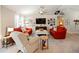 Spacious living area with comfortable seating, large TV, and a gallery wall at 318 Stone Castle Loop, Lady Lake, FL 32159