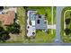 Aerial view showing a home's pool, landscaping, and driveway at 318 Stone Castle Loop, Lady Lake, FL 32159