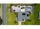 Aerial view of a home with a pool and landscaped yard at 318 Stone Castle Loop, Lady Lake, FL 32159