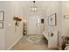 Inviting entryway with a bench, rug, and coat rack at 318 Stone Castle Loop, Lady Lake, FL 32159