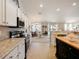 Well-equipped kitchen boasting granite countertops and ample cabinet space at 318 Stone Castle Loop, Lady Lake, FL 32159