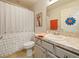Simple bathroom with single vanity and shower/tub combo at 318 Stone Castle Loop, Lady Lake, FL 32159