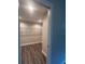 Spacious walk-in closet with wood flooring and wire shelving at 12202 Se 87Th Ct, Belleview, FL 34420