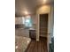 Walk-in pantry with wire shelving and luxury vinyl flooring at 12202 Se 87Th Ct, Belleview, FL 34420