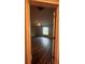 Large bedroom with a ceiling fan, window, and wood-look flooring at 12202 Se 87Th Ct, Belleview, FL 34420