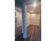 Spacious walk-in closet with wood flooring and wire shelving at 12202 Se 87Th Ct, Belleview, FL 34420