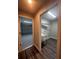 Laundry room with utility sink and wood flooring at 12202 Se 87Th Ct, Belleview, FL 34420