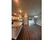 Spacious dining room with wood-look flooring and access to the backyard at 12202 Se 87Th Ct, Belleview, FL 34420