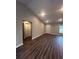 Bright living room with wood-look floors and high ceilings at 12202 Se 87Th Ct, Belleview, FL 34420