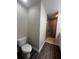 Bathroom with a large walk-in shower and wood-look flooring at 12202 Se 87Th Ct, Belleview, FL 34420