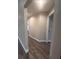 Bright hallway with wood-look floors and neutral paint at 12202 Se 87Th Ct, Belleview, FL 34420