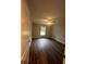 Spacious bedroom with hardwood floors and ceiling fan at 12202 Se 87Th Ct, Belleview, FL 34420