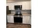Modern kitchen with stainless steel appliances and granite countertops at 12202 Se 87Th Ct, Belleview, FL 34420