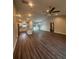 Open concept living room and kitchen with wood-look floors at 12202 Se 87Th Ct, Belleview, FL 34420