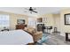 Main bedroom with kitchenette, large bed, and sitting area at 344 Chadwick Dr, Davenport, FL 33837