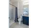 Bathroom with shower, toilet, and dark blue vanity at 6047 Broad Oak Dr, Davenport, FL 33837