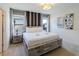 Spacious bedroom with a king-size bed and stylish nightstands at 6047 Broad Oak Dr, Davenport, FL 33837
